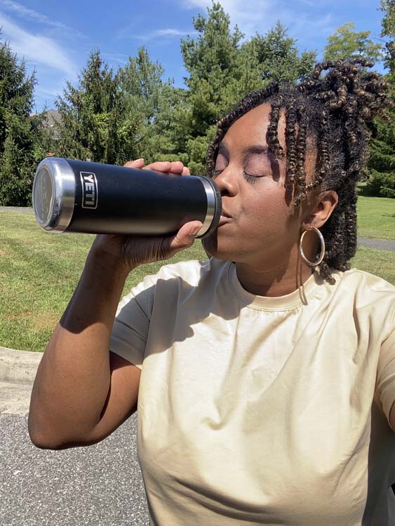 Girl drinking from Yeti water bottle