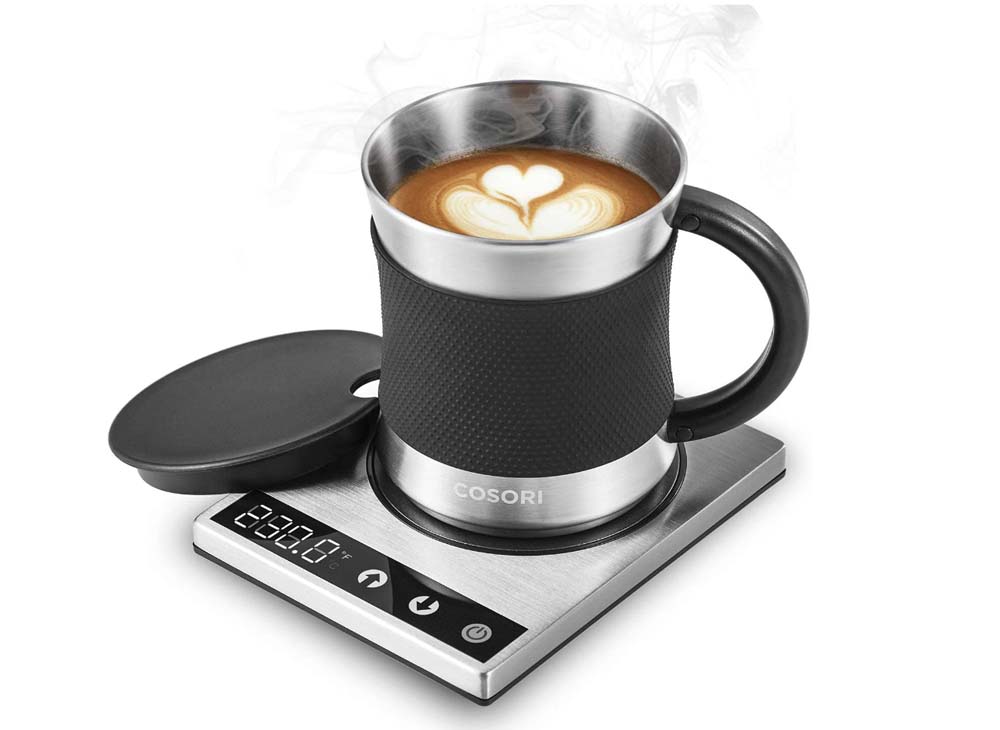 Coffee mug sitting on warmer, lid on side