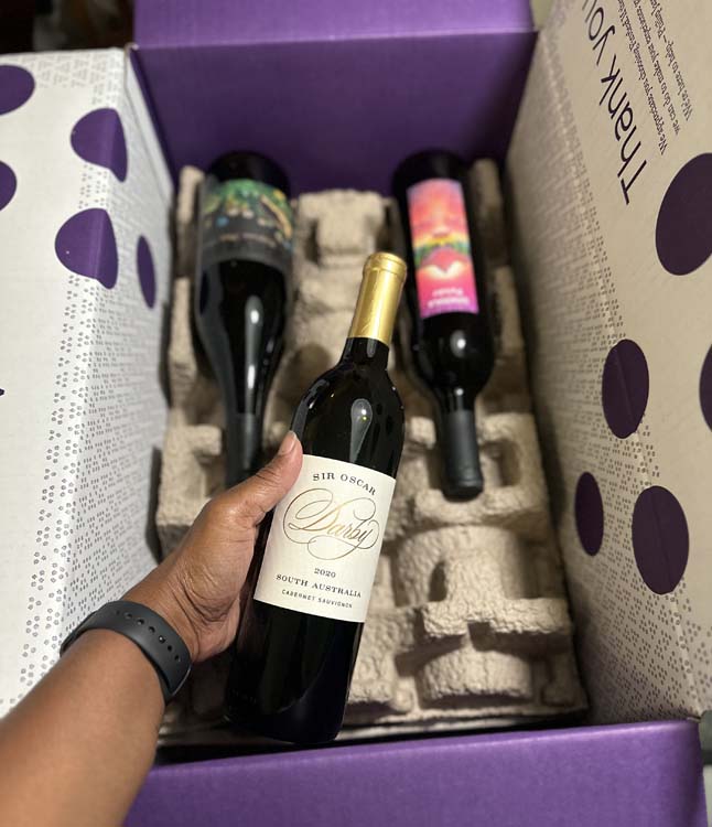 Wine bottle in a box with two other bottles