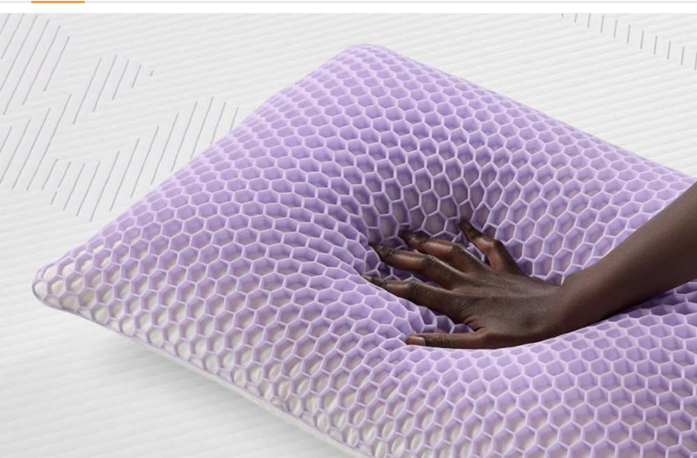 Hand pressing into pillow